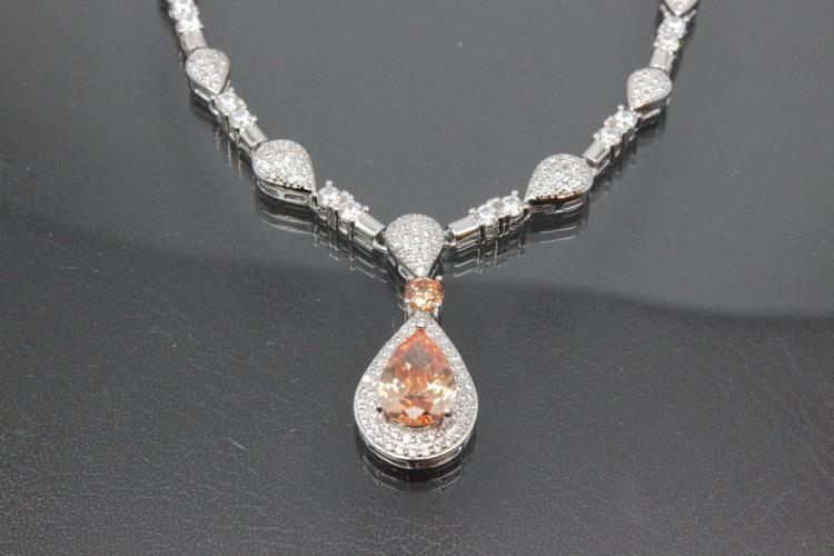 aLEm necklace  Teardrop of the Sun  with champagne color and white Zirconia 925/- Silver  rhodium plated with trigger clasp