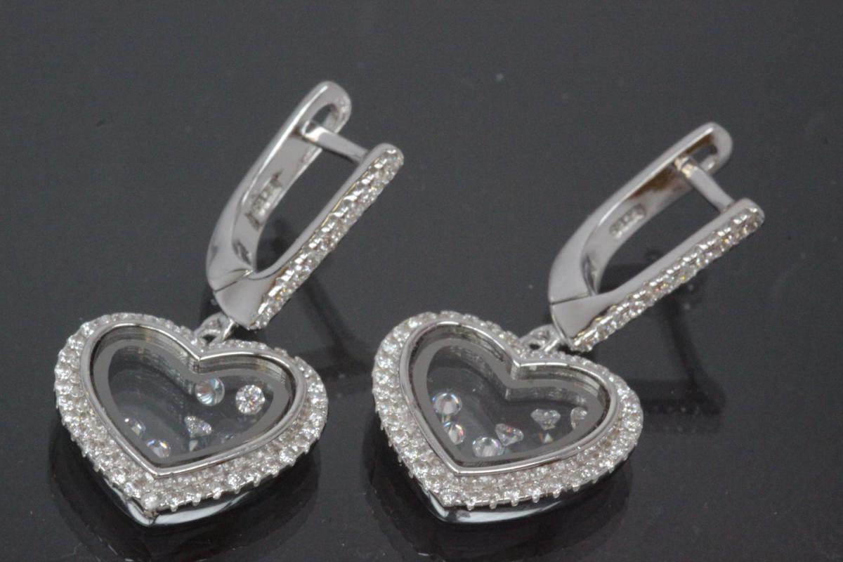 aLEm Earring with leverback 925/- silver, approx sizes H 31,0mm, B 15,5mm rhodium plated with Zirconia heart,  in the center moving Zirconia between two glasses and security leverback